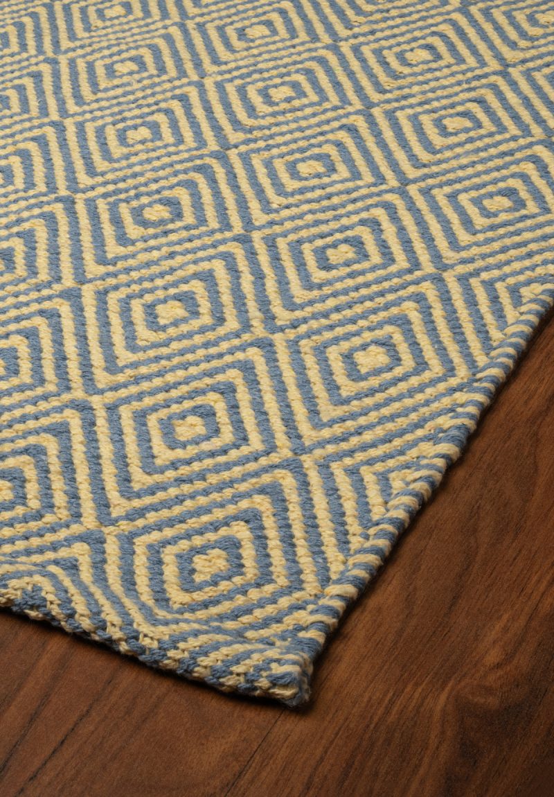 Angled floor view of Ashford Denim Yellow Rug